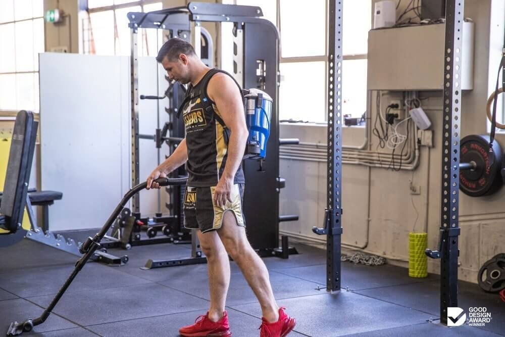 A Man using Pacvac vacuum Cleaner